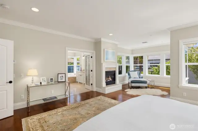 Spacious primary suite with fireplace and sitting room