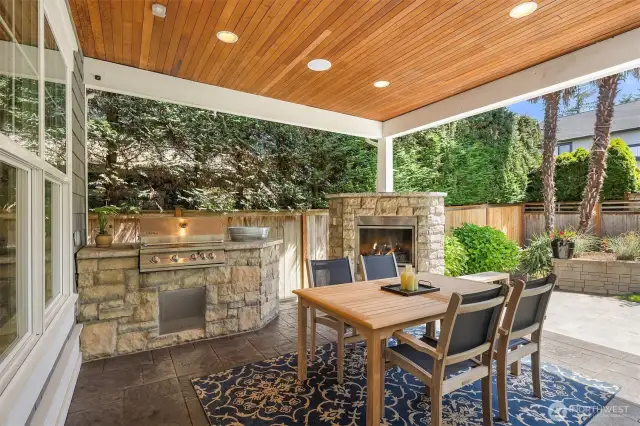 Covered outdoor patio with bar-b-que and fireplace