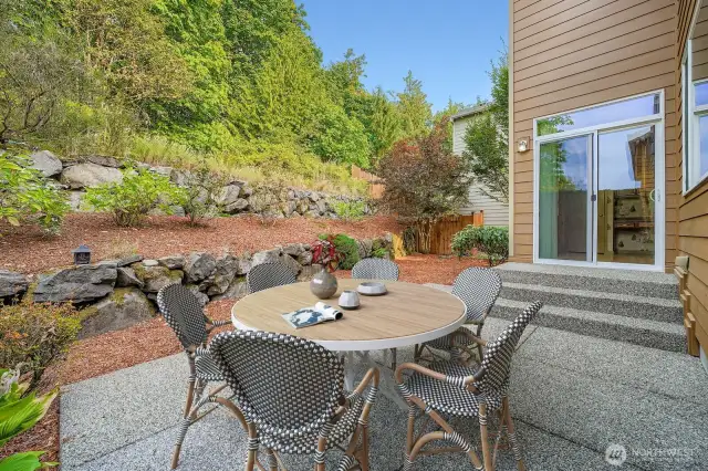 Outdoor patio area adjacent to greenbelt -for added privacy - virtually staged
