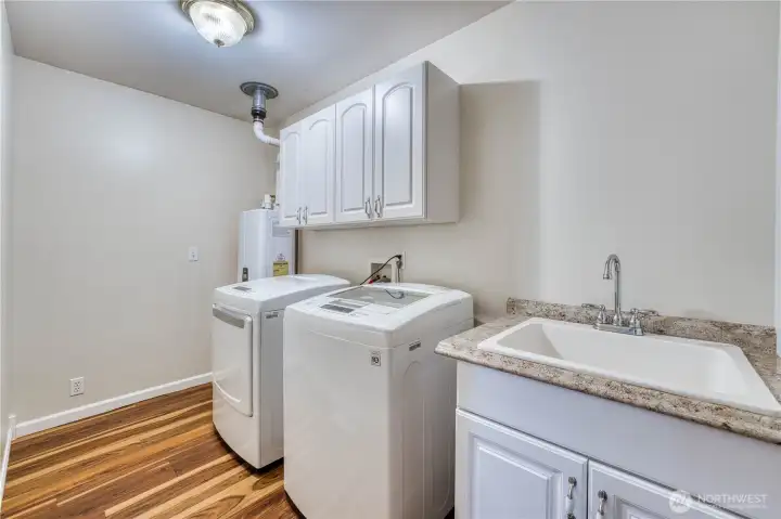 Utility Room with newer LG Washer & Dryer, and Tankless Water Heater...