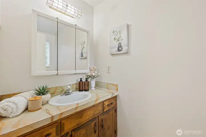 Half bathroom off primary bedroom.
