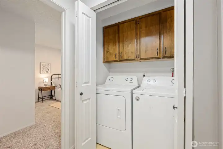 Laundry area with built-in cabinets. W/D stay!