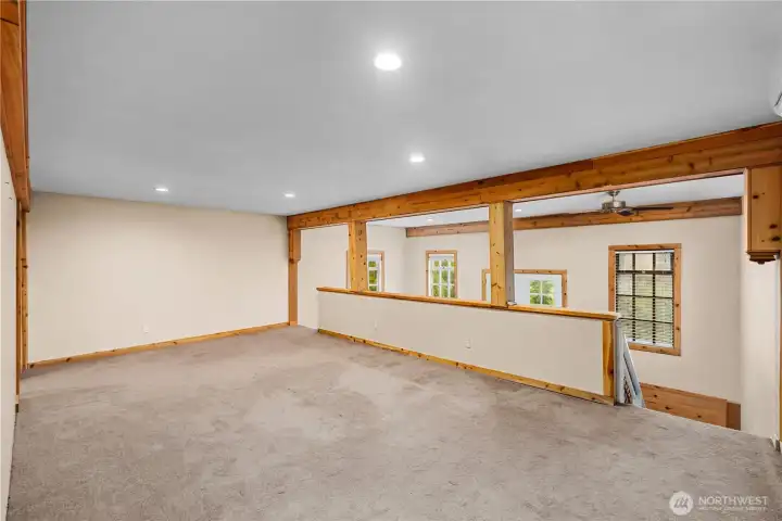 Split level, loft-like 2nd floor serves as the primary suite.