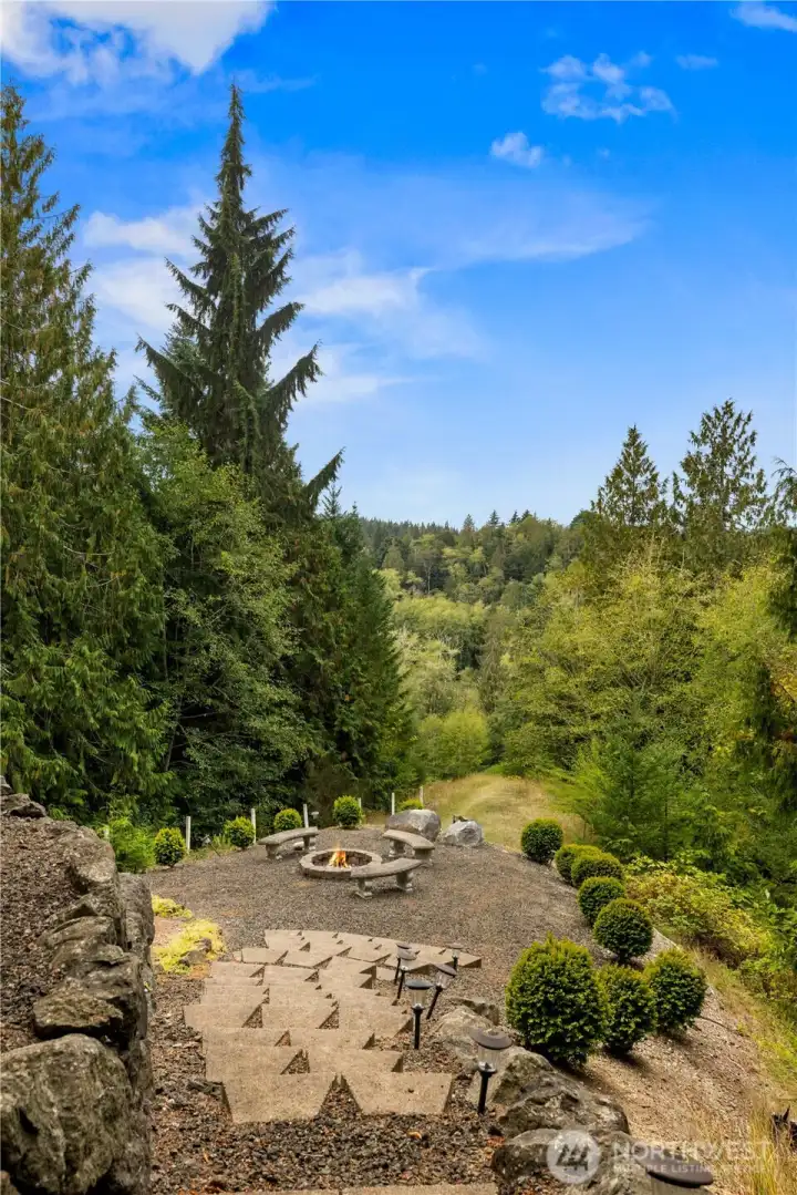 Steps lead to the coversation/firepit.