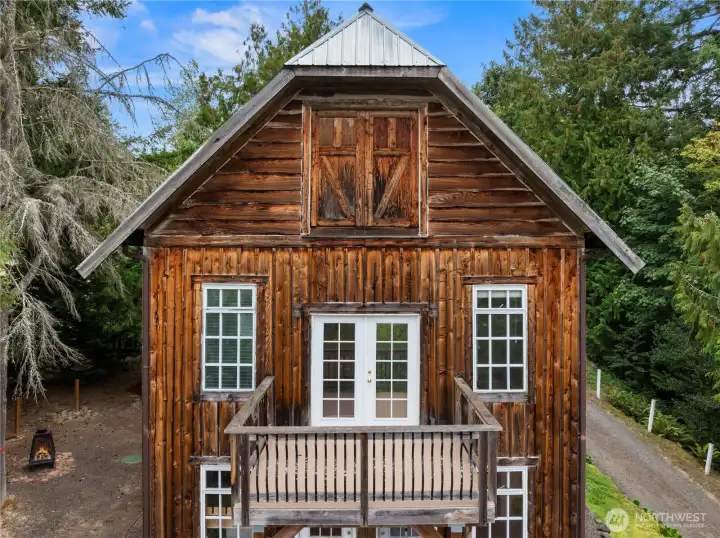 Cedar siding adds visual interest and a nod to its previous iteration as a barn.