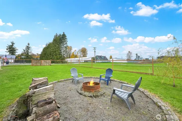 Imagine relaxing in your firebit area with a huge fenced yard.