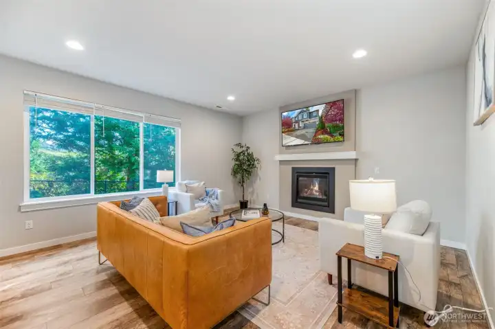 Open concept living room with gas fireplace and