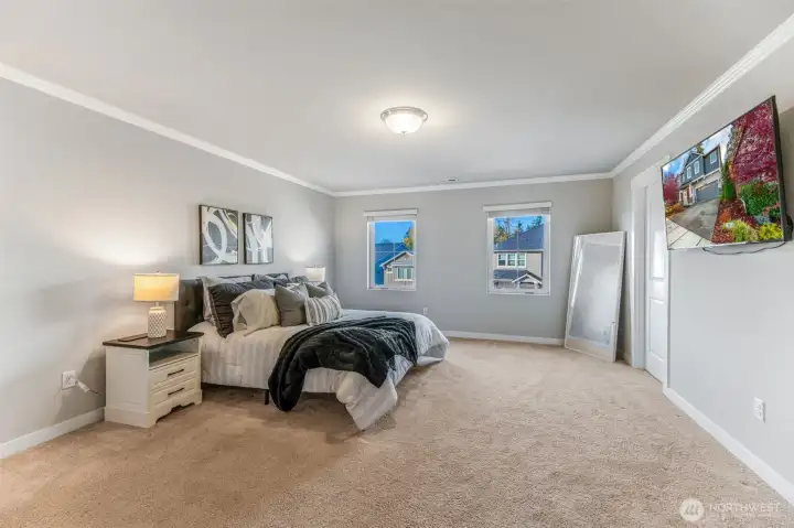 Primary suite with en suite bath and two walk in closets.