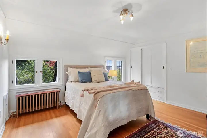 This bedroom has the original lighting and the original screens on the windows.