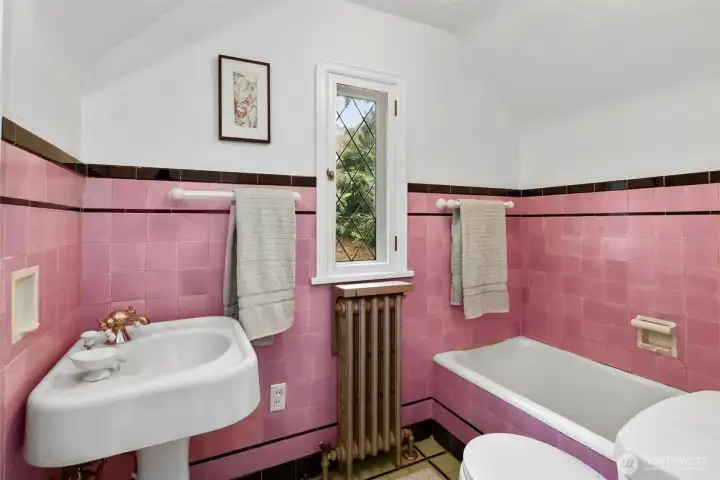 All the bathrooms celebrate 1927 with exquisite original tile and classic historic details, showcasing the home’s timeless character