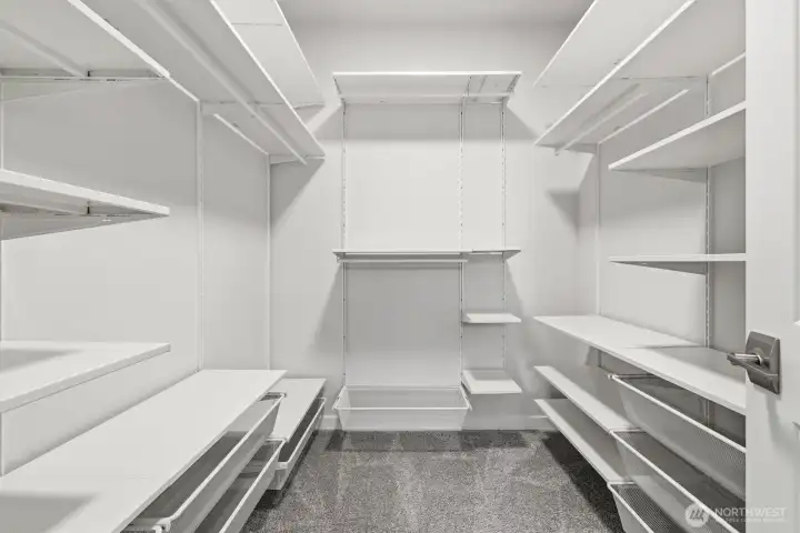 Spacious closet off primary bedroom with lots of storage.
