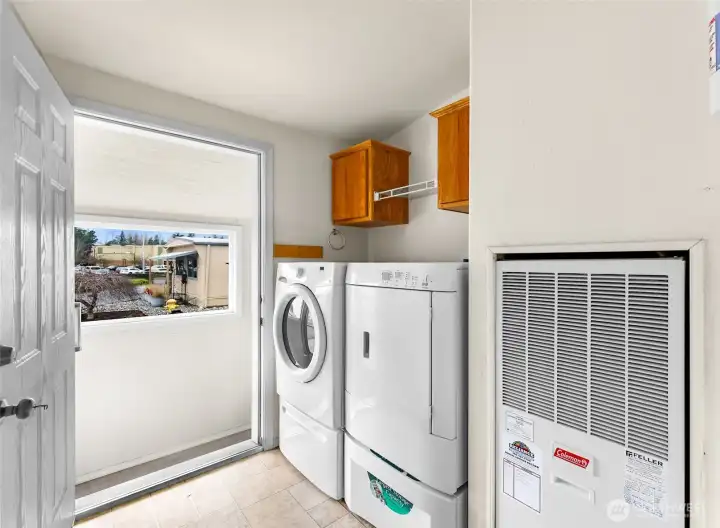 Front Door opens to the Utility Room.  Utility Room then brings you to the hallway leading to the 3 Bedrooms and the Guest Bathroom.