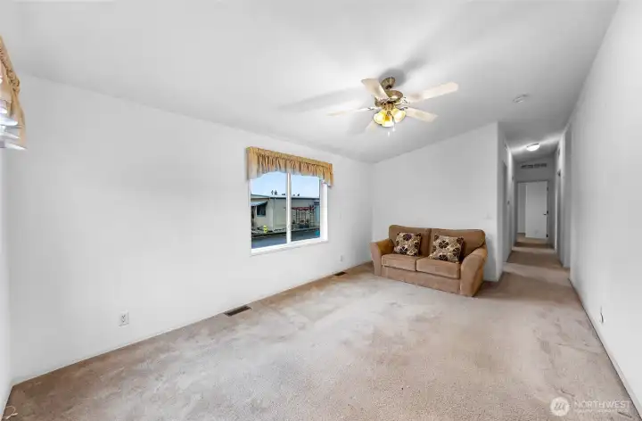 Living Room view towards the Hallway leading to the Bedrooms.