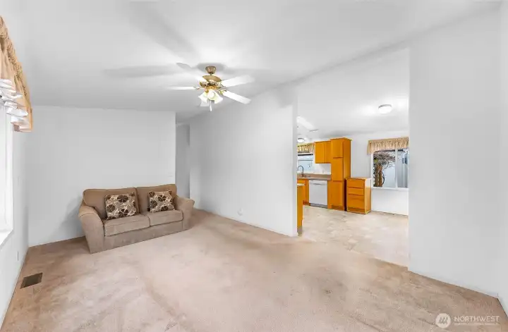 Living Room with entrance to the Kitchen and Dining Area.