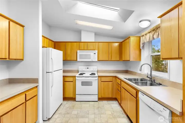 Large spacious well lighted Kitchen with a Skylight. Tons of space for entertaining.
