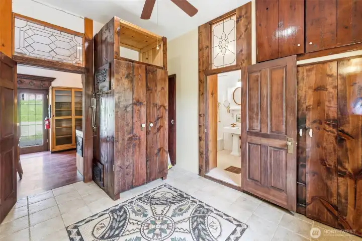 Laundry room with kitchen on the left and bathroom on the right