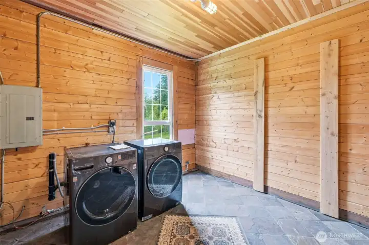 Tack room with washer, dryer, and heated tile pad