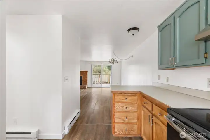 Kitchen leads to dining area and great room.