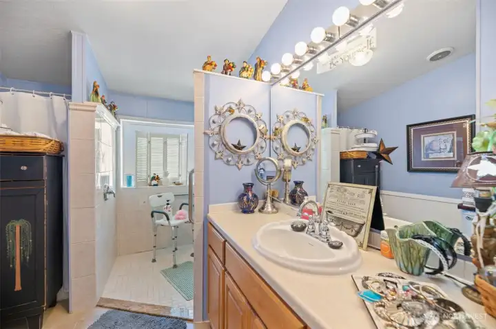 Primary bathroom has 2 showers. One standard and the other is a large step in.