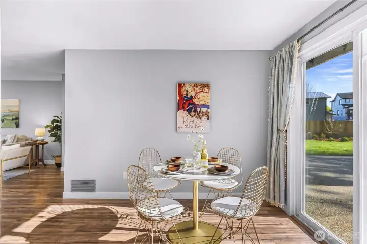 The eating space is bathed in light from the sliding door