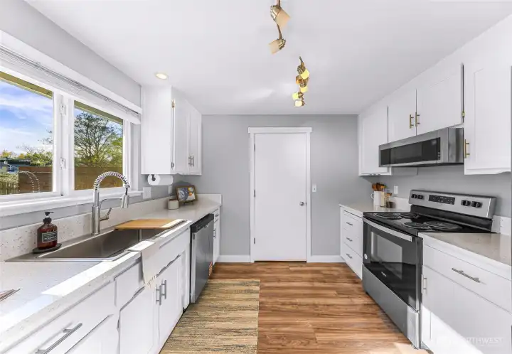 The door leads to the finished utility space, then through to the garage