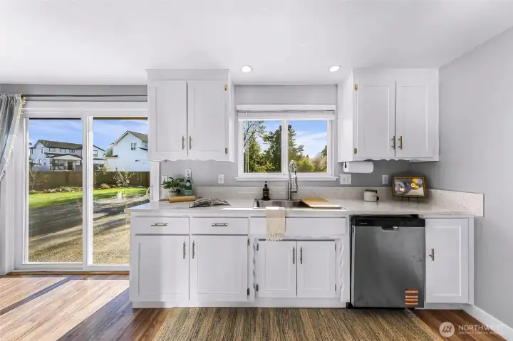 A lovely view of the yard while you wash the dishes.