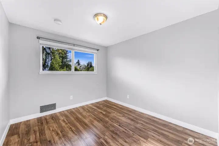 Bedroom 2 faces the sunny back yard