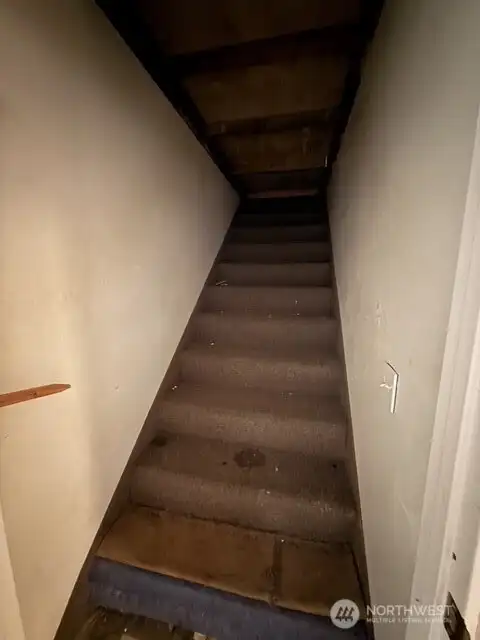 Staircase to basement that has been blocked off.