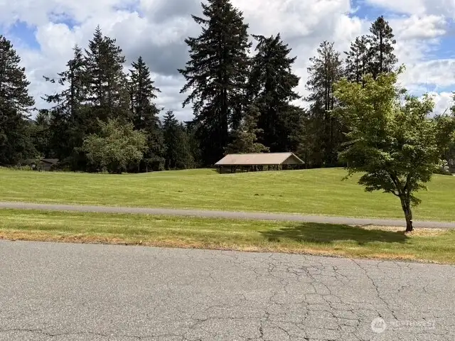 Home is located directly across from the community center park and pool.