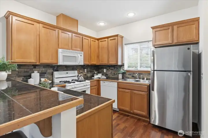Spacious kitchen with gas stove, built in microwave, plenty of counter and cabinet space