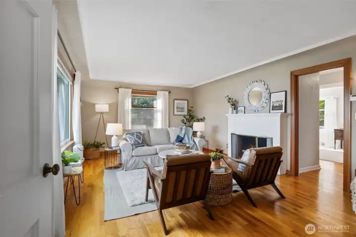 The living room features coved ceilings, original plaster, hardwood floors and stunning views.
