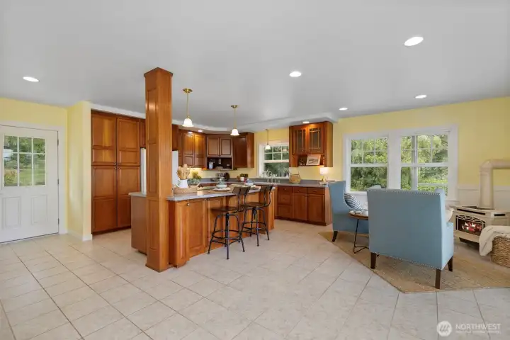 This large kitchen space has room for a table and additional gathering space.
