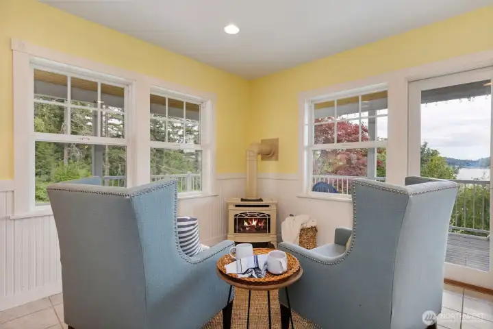 A snug spot to enjoy morning coffee by the fire while enjoying views of the bay and the garden.