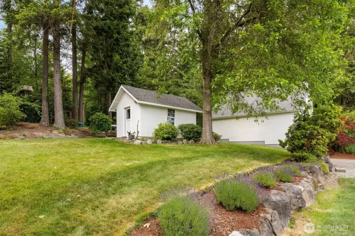 Well house with attached garden shed.