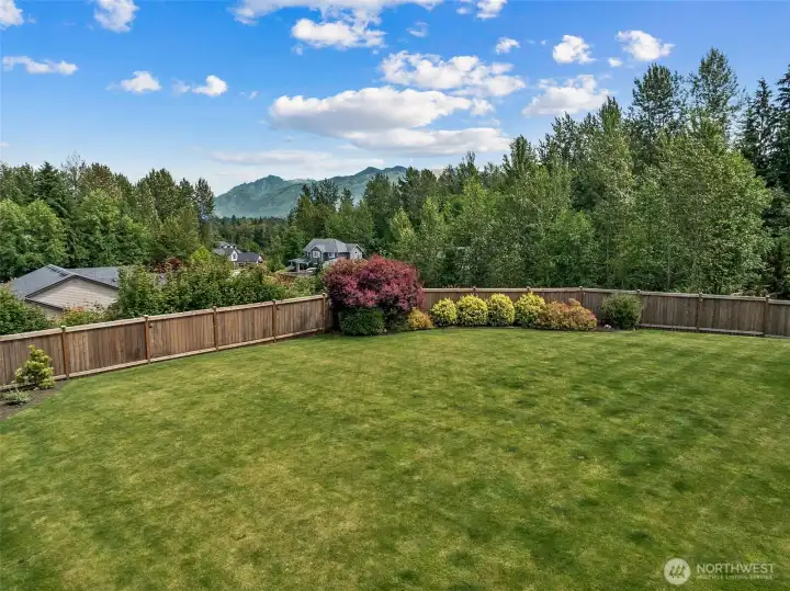 Aerial view of the backyard and Cascade Mountains Aerial view of the backyard and Cascade Mountains