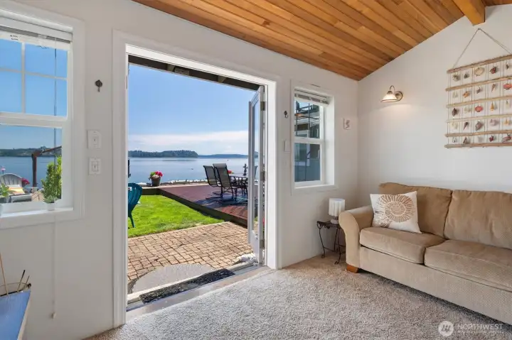 French doors open to a flexible den ideal for a home office or guest space