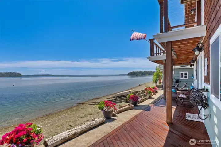 Expansive waterfront deck with sweeping beach views