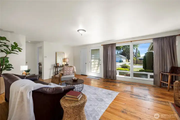 Large picture windows and glass front door bring in tons of natural light.
