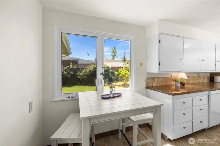 The breakfast nook in the kitchen is the perfect place for casual dining or a cup of coffee in the morning.