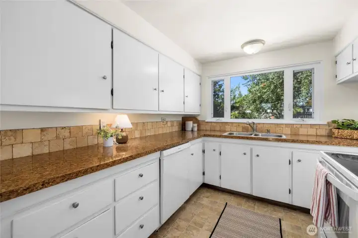 Another view of the spacious kitchen counter area.