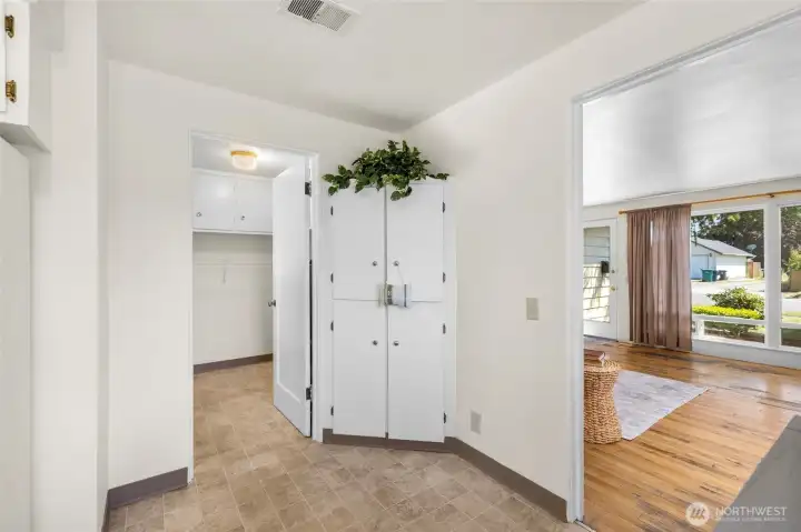 A built-in corner hutch could function as a pantry or just for additional storage.  Living room through the door at right, laundry through the door on left.