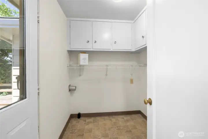The laundry room also leads outside to the back deck and fenced back yard.