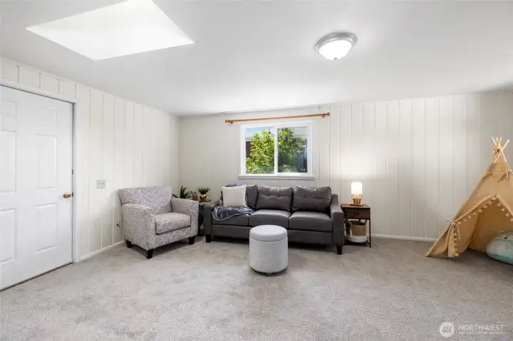 A second living area offers flexible space - this could be a 3rd bedroom, playroom, craft room, rec room, work from home/office, or anything else you need.  Garage through door at left.