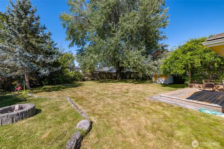 Such a great yard.  Nicely defined areas include the firepit area and the deck.