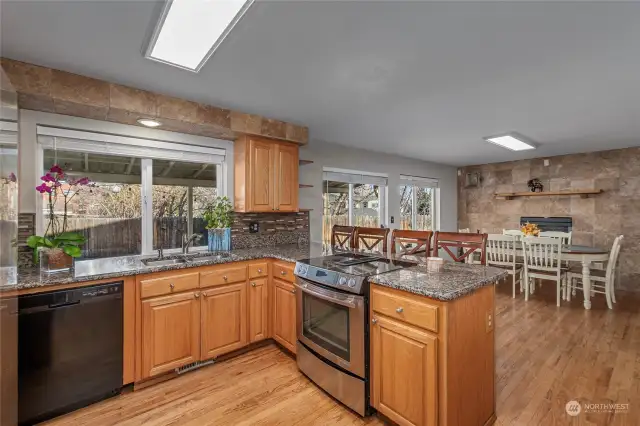 Open Concept Kitchen with plenty of seating and fireplace