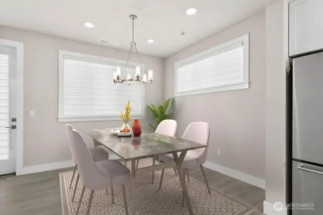 Virtual staging.  Lots of windows and light in the dining area.  Seating for 6 or more!