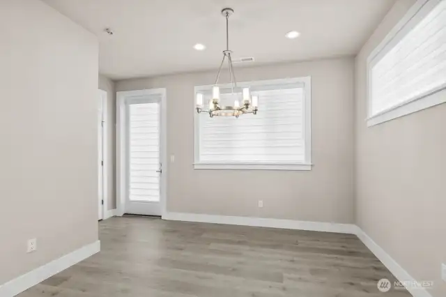 Dining area opens to the patio with the huge covered Trex deck spanning the full width of your home!