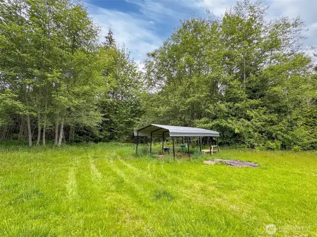 Carport, could be moved closer to the house.  It was used as a camping area.