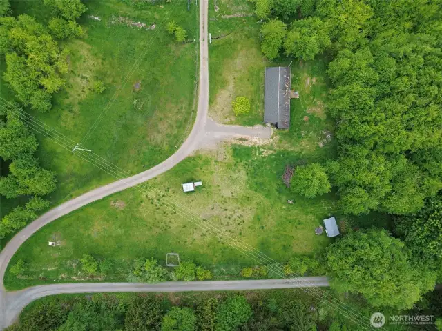 Aerial view, it does go into the trees past the carport. And also above the driveway.