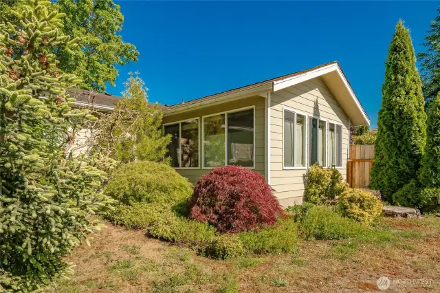Asian garden area with with premier views and light from this permitted addition with vaulted ceilings and walls of windows.
